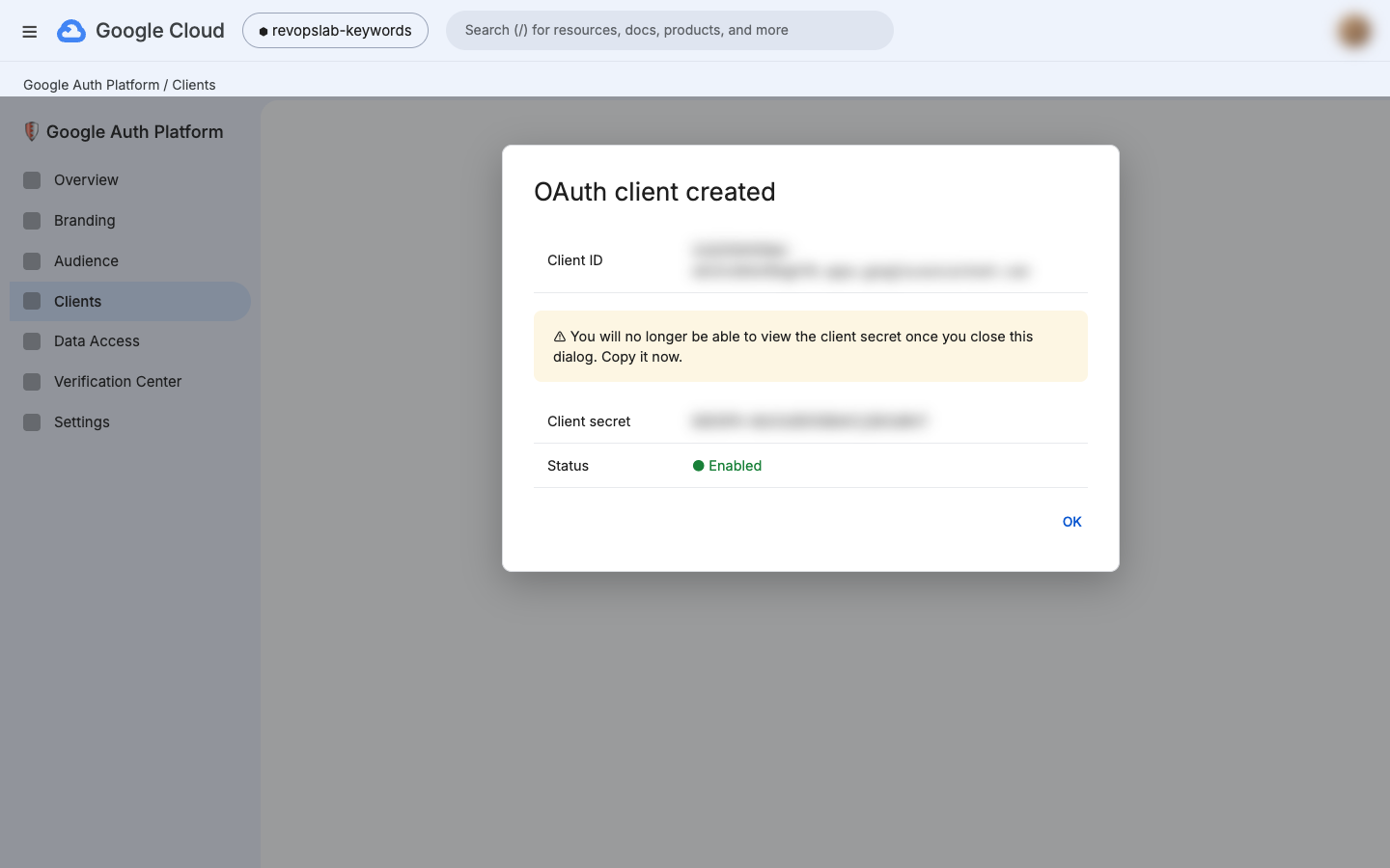 OAuth client created dialog with blurred client ID and secret